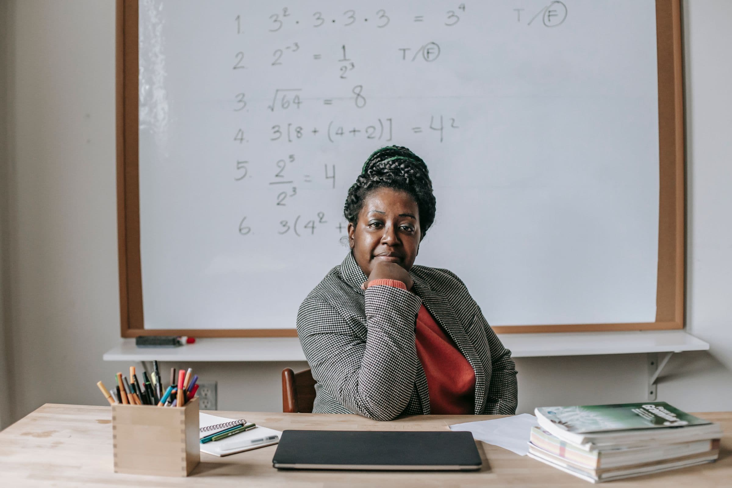 A confident educator at her classroom desk